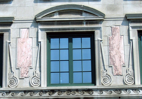Arched pediment at window head